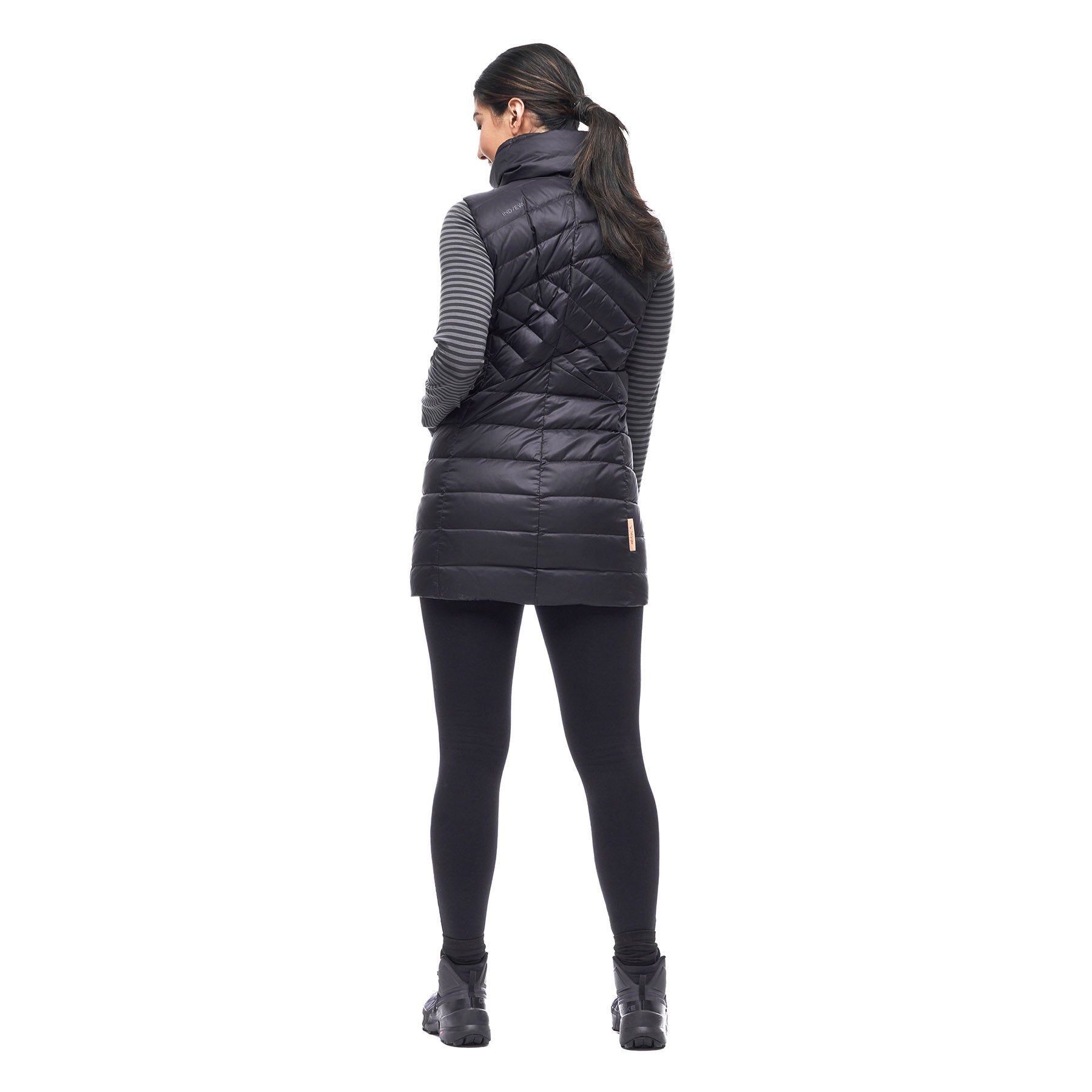 Image features the back of a female model wearing the Indyeva Kapa sleeveless vest in black.