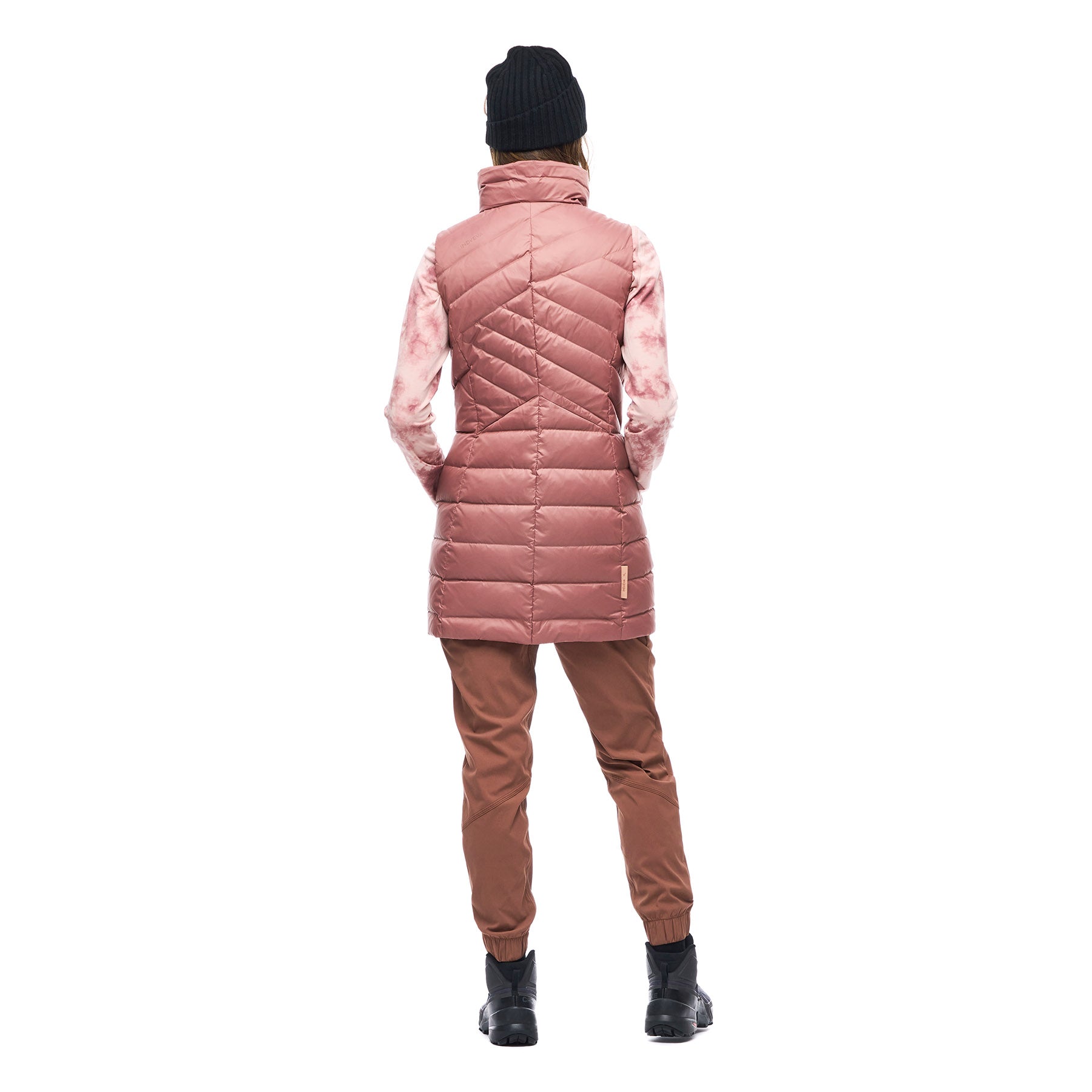 Hero image featuring the back of a female model wearing the Indyeva Kapa sleeveless vest in red rose.