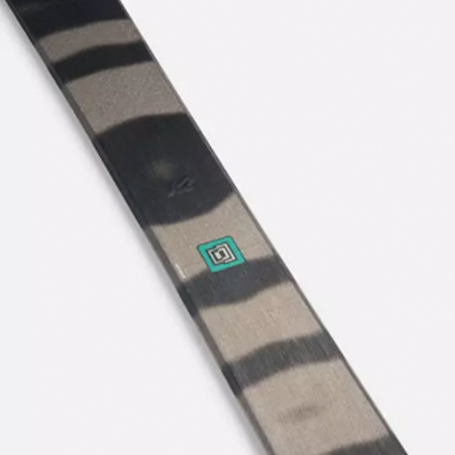 Image features the middle of the Women's K2 Mindbender 85 skis in black with grey stripes.