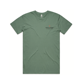Hero image of kickback shirt in sage green with be logo and text that says quality goods for the curious crowd on the chest