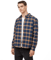 Hero image featuring a male model wearing black jeans and the Ten Tree Kapok Shirt in blue with brown stripes.