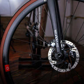 Image features the front wheel and brakes of the BSC Ti road bike