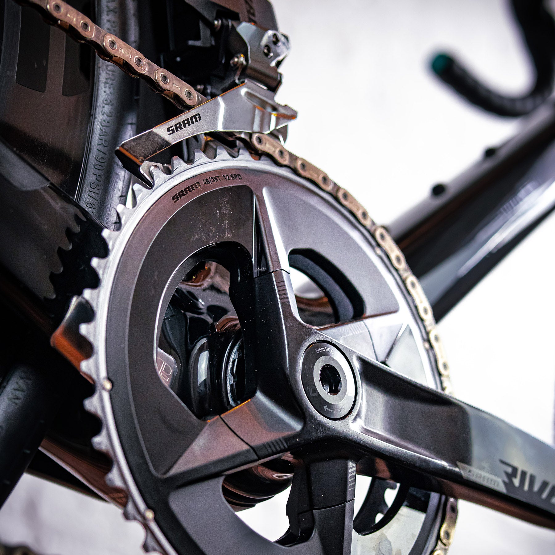 Image features the right pedal, chain, and gears on the Chapter 2 TOA bike