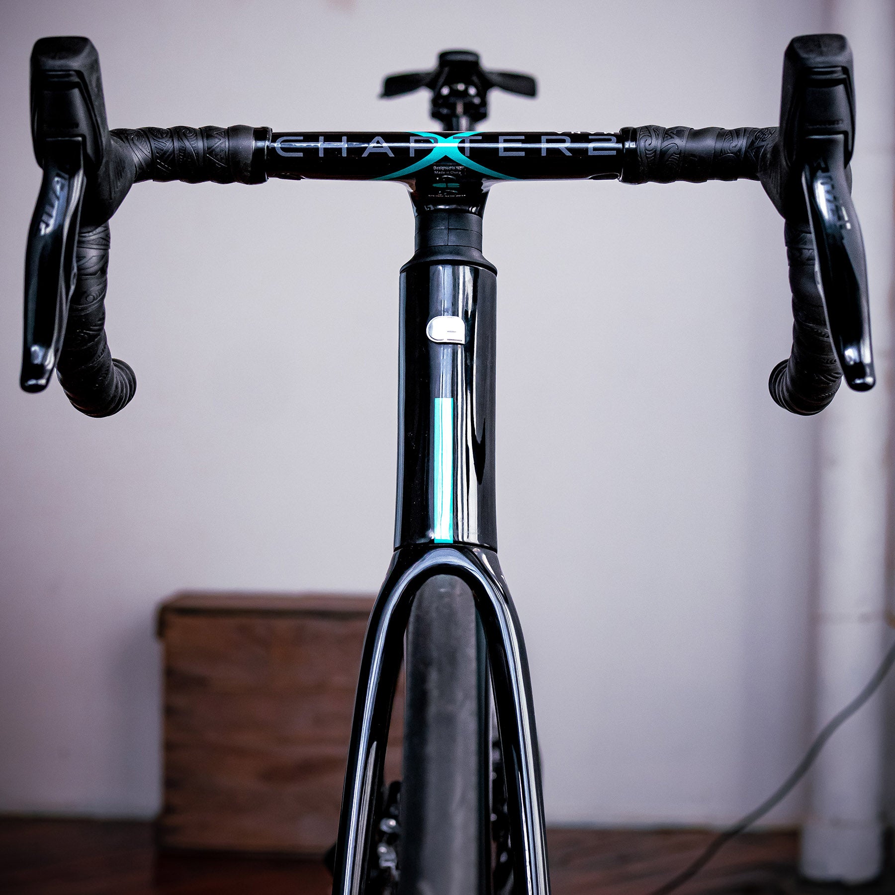 Image features a front facing shot of the handle bars and frame on the Chapter 2 TOA bike