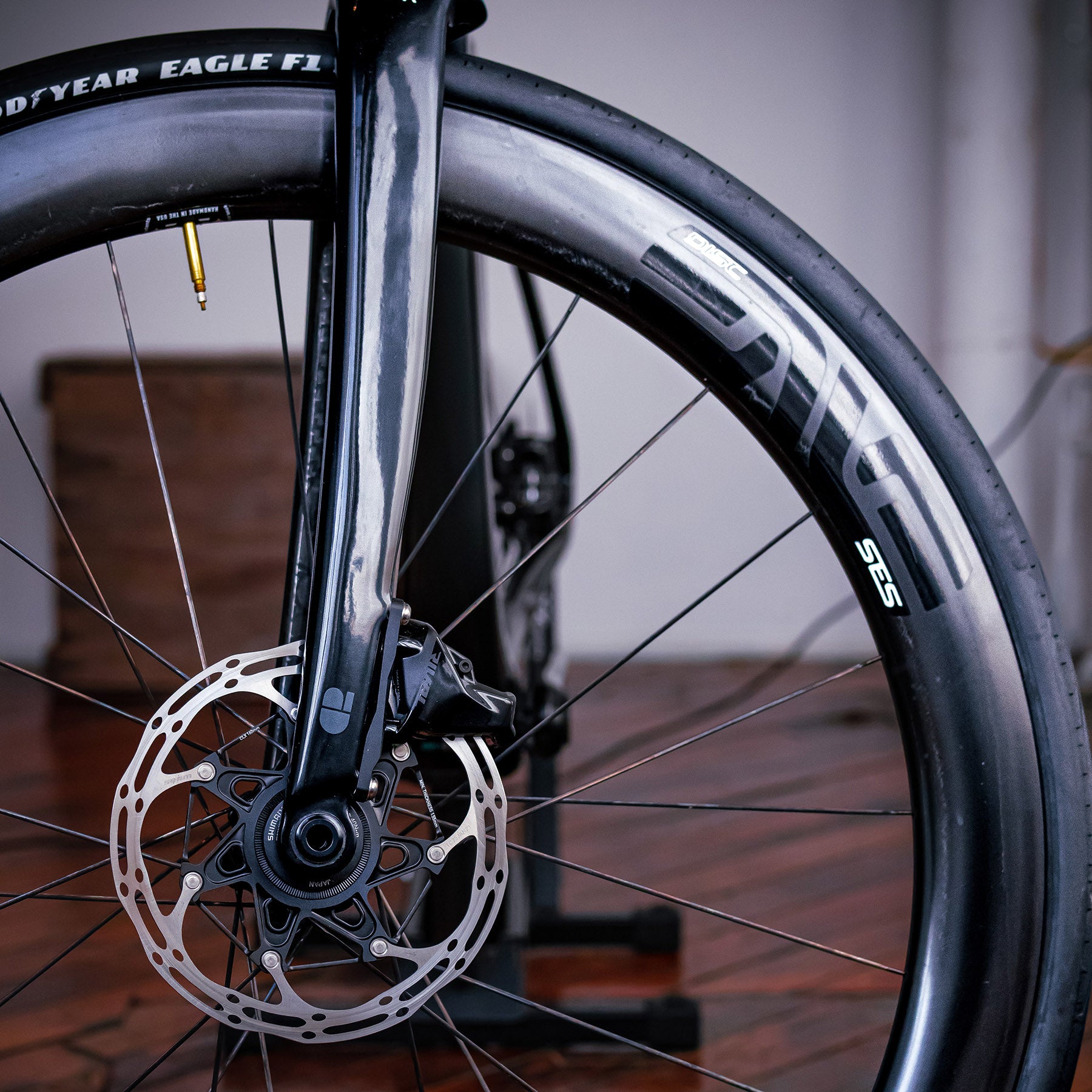 Image features the front tire turned to the right showcasing the brakes, tire, and wheel on the Chapter 2 TOA