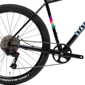 Image featuring the back half of the State 4130 All-Road bike in black with colored stripes on the frame.